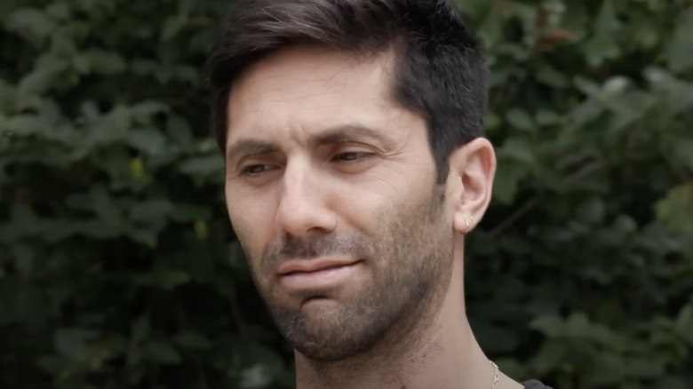 nev schulman from catfish surprised wincing outdoors